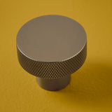 Metallic knob on a yellow background